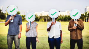 Millennials holding checkmark signs